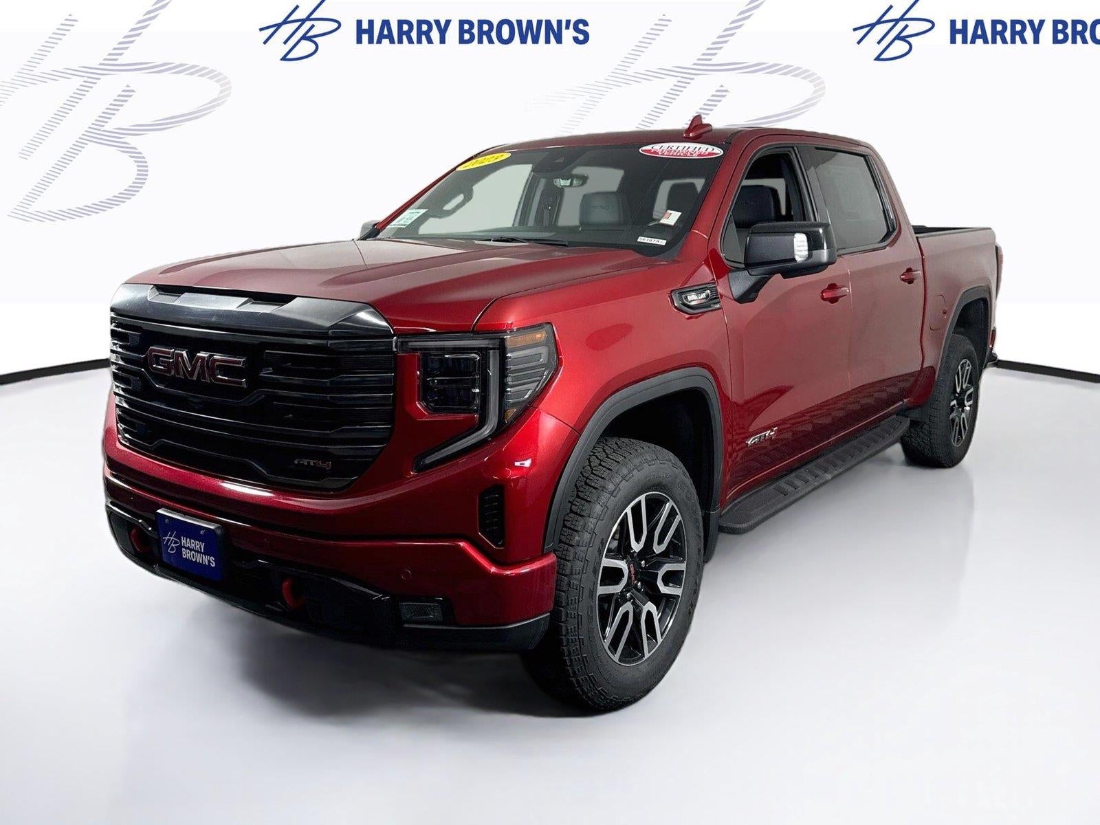 2023 GMC Sierra 1500 AT4 in Volcanic Red Tintcoat — front three-quarter view